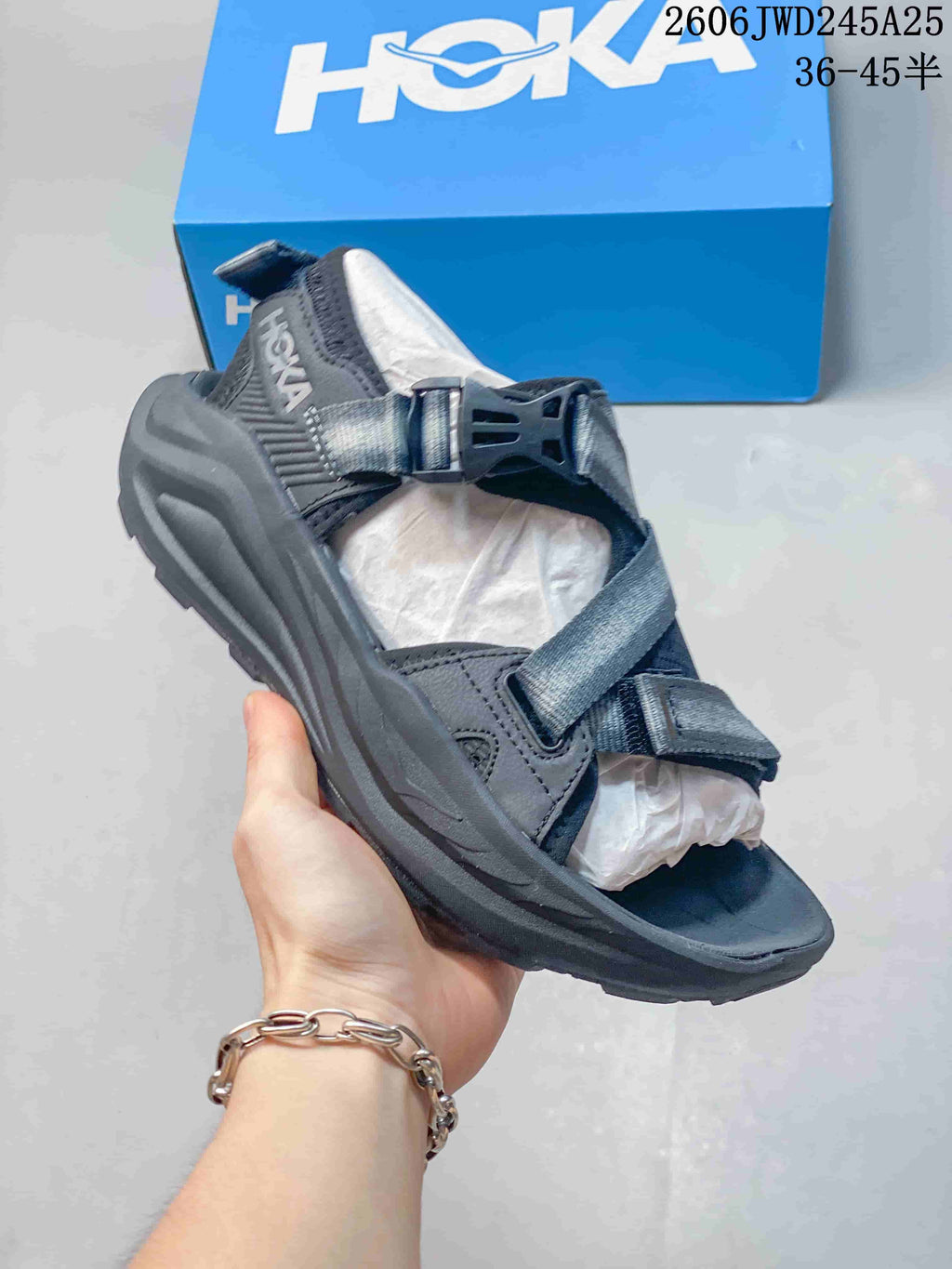 Dark gray HOKA Infini Hike TC sandal with adjustable straps and buckle closure
