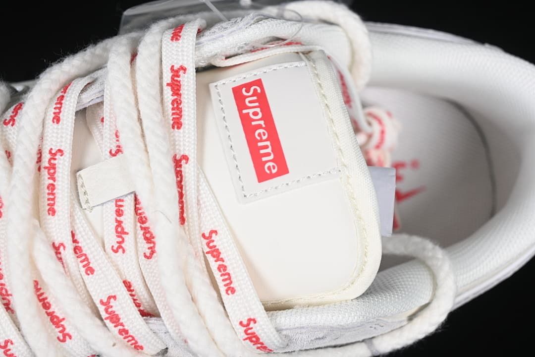 Close-up of the tongue label and laces with red Supreme text