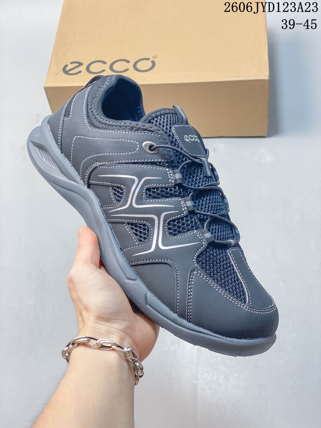 Angled side view of the gray ECCO low-top shoe