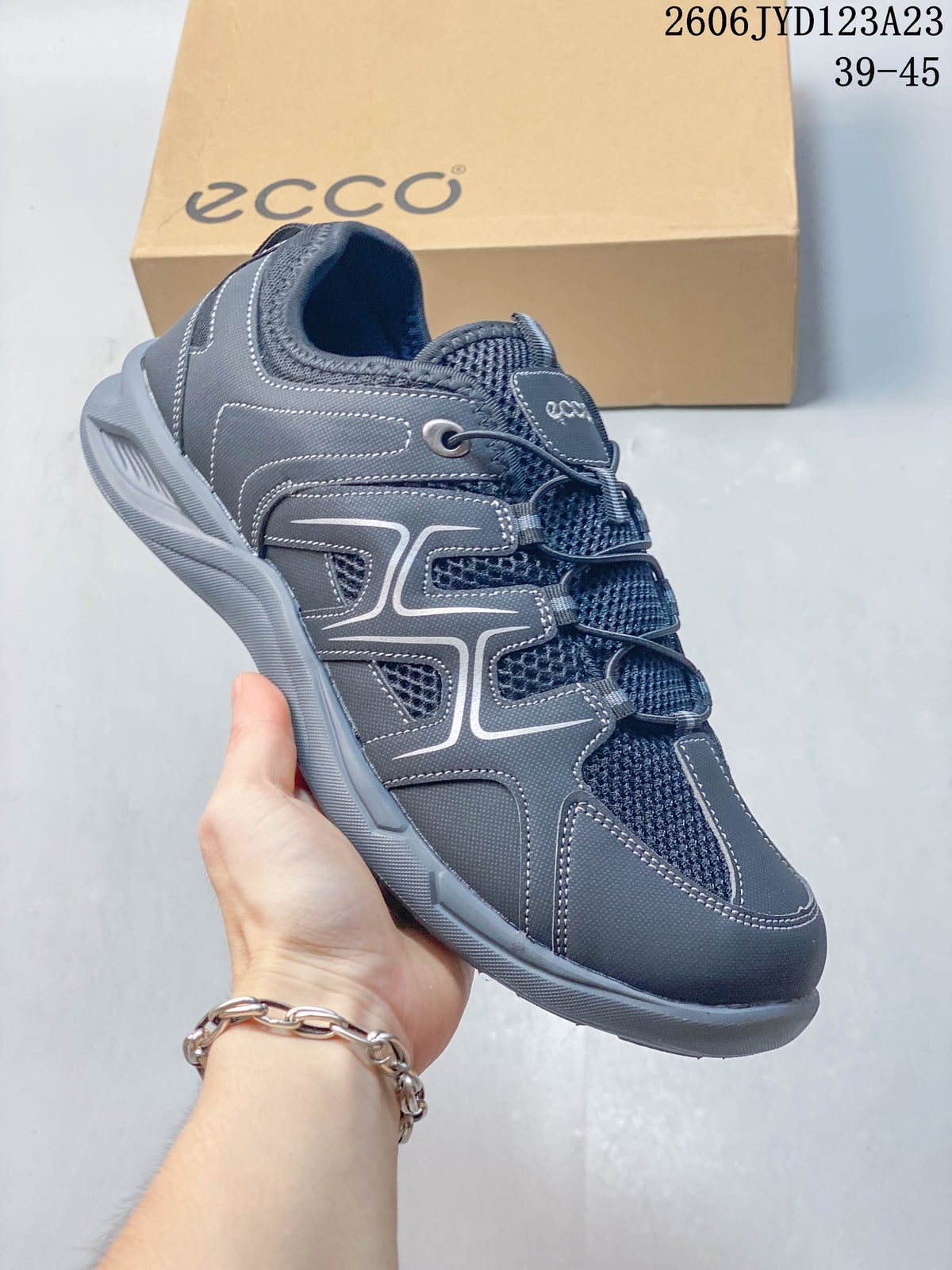 Angled side view of the gray ECCO low-top shoe