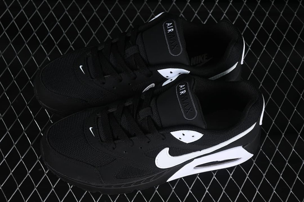 Pair of black and white Air Max Correlate sneakers viewed from above