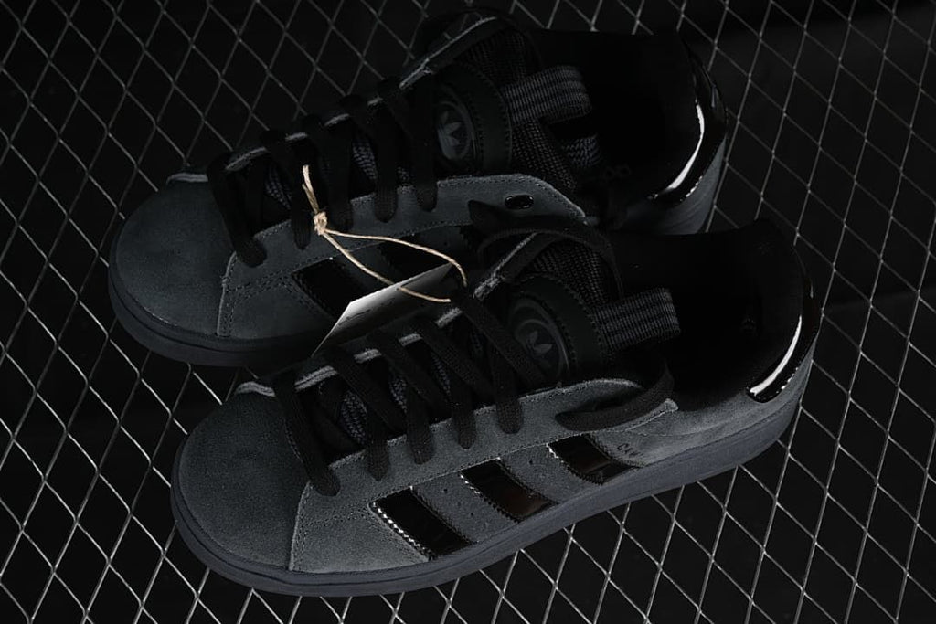 Pair of charcoal gray and black Campus 00s sneakers shown from above