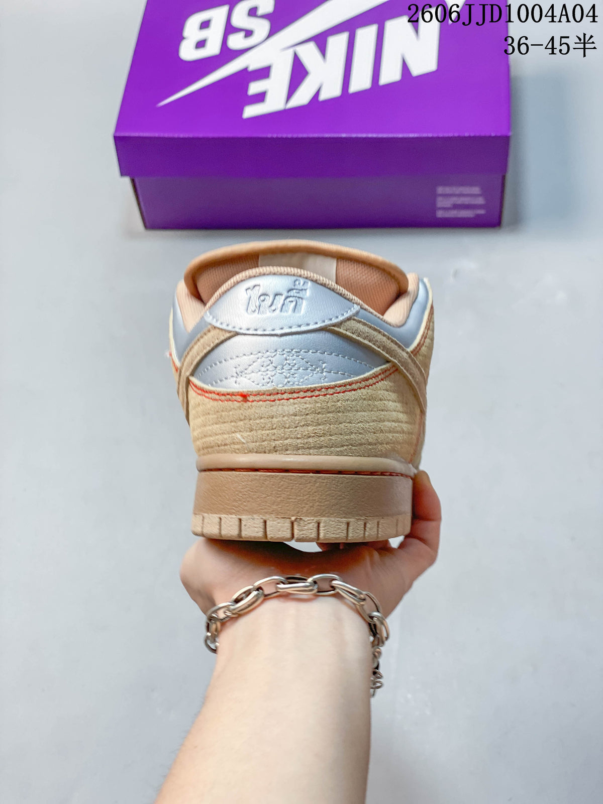 Rear view showing the textured tan heel and metallic silver heel panels