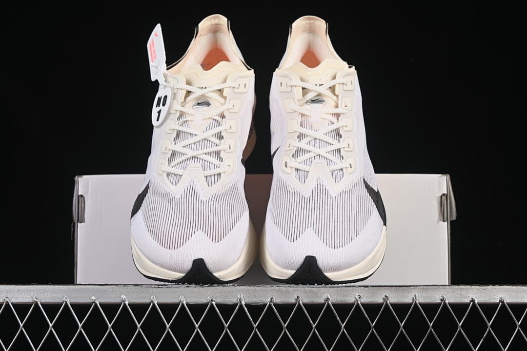 Front view of the pair of white road racing shoes