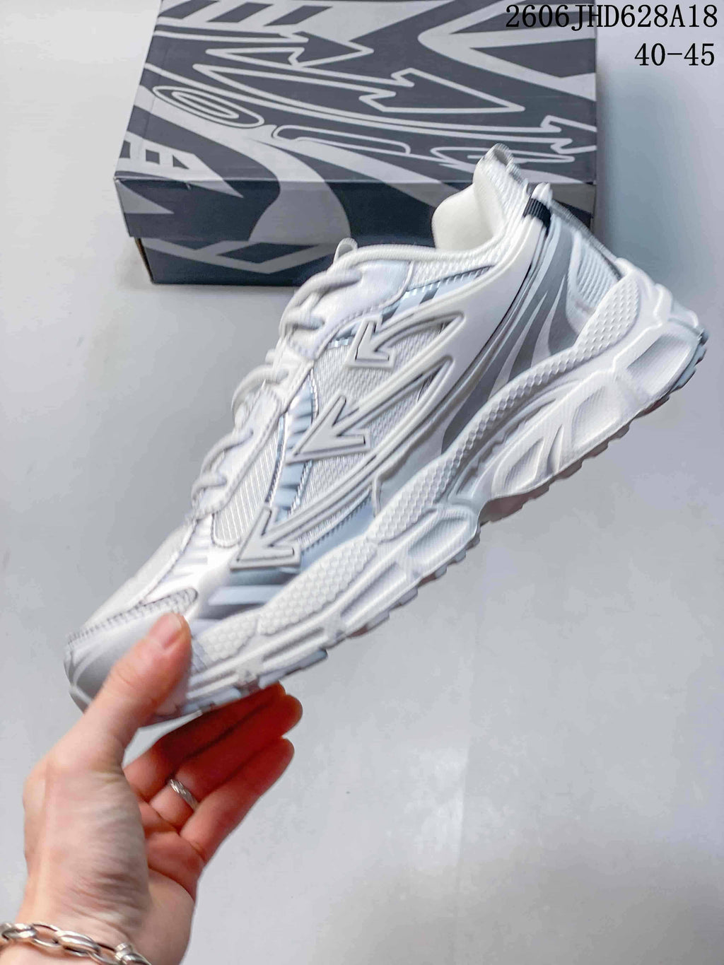 Side view of the low-top sneaker with layered silver-tone details