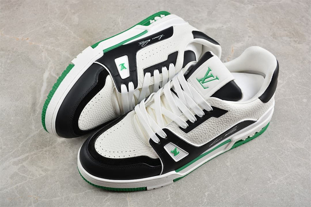 Pair of white, black and green LV Trainer sneakers shown from above.