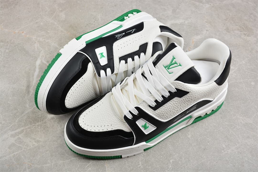 Pair of white, black and green LV Trainer sneakers shown from above.