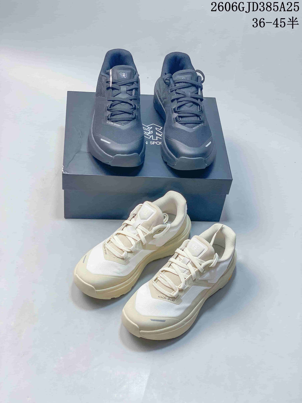 Dark gray and off-white Kolon Sport shoes shown from above