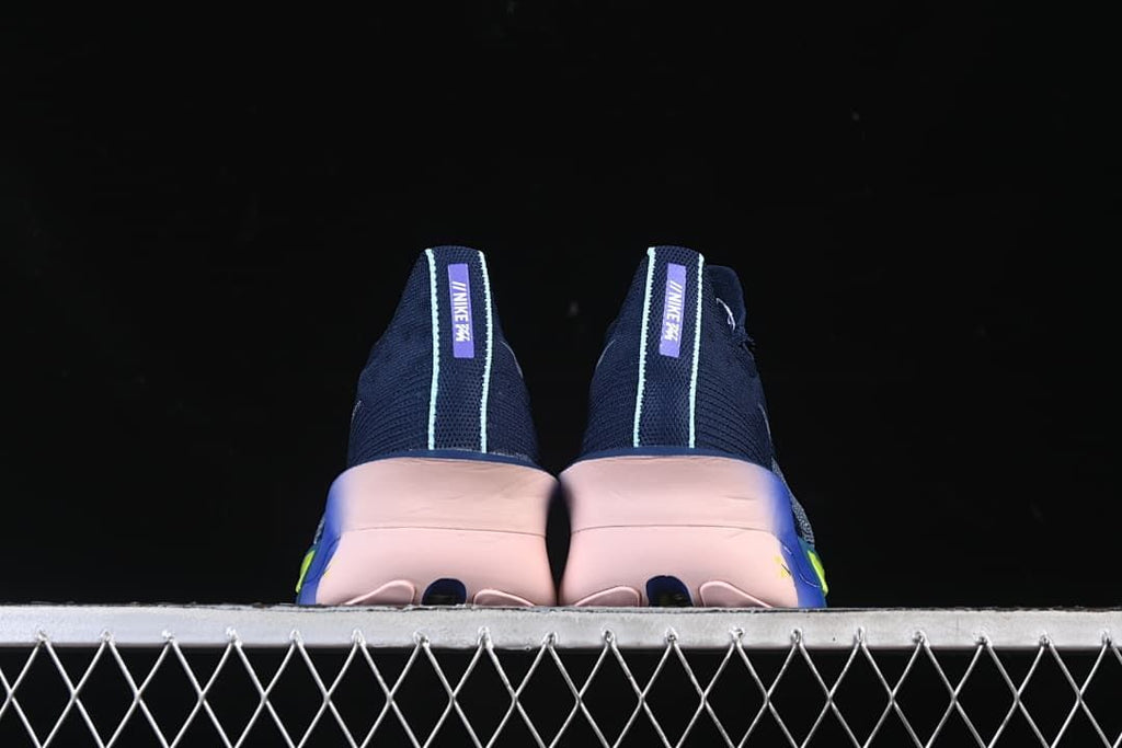 Rear view of the pair, showing pale heel trim and pink-toned soles.
