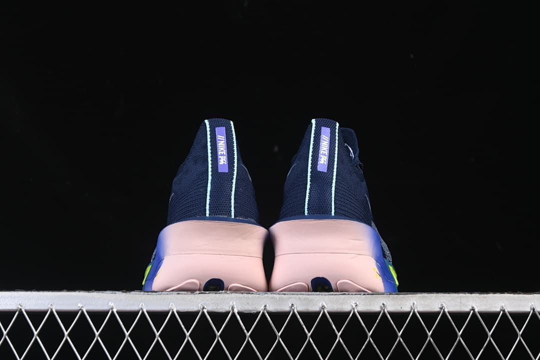 Rear view of the pair, showing pale heel trim and pink-toned soles.