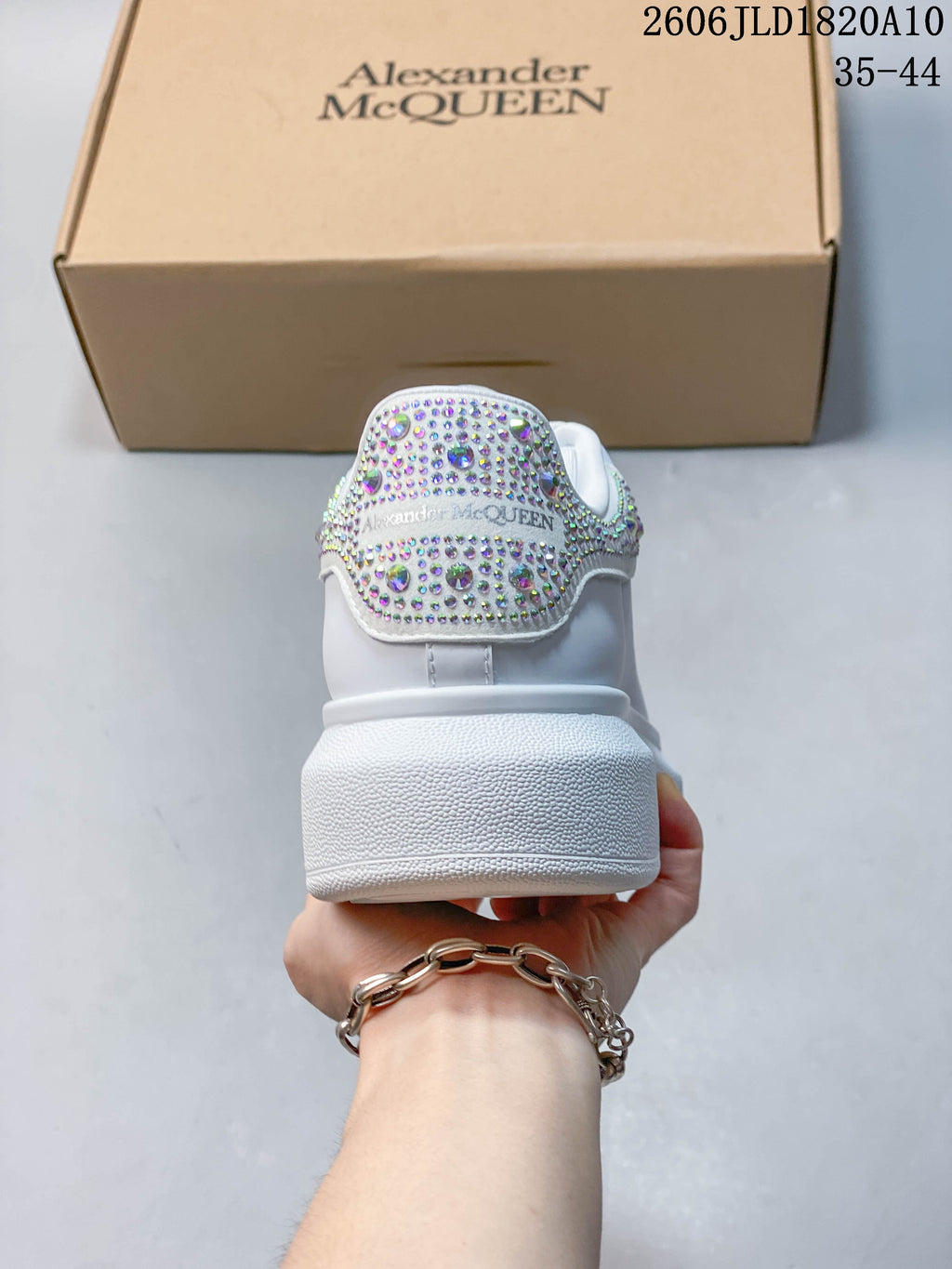 Rear view showing the sparkling heel detail and thick white platform sole