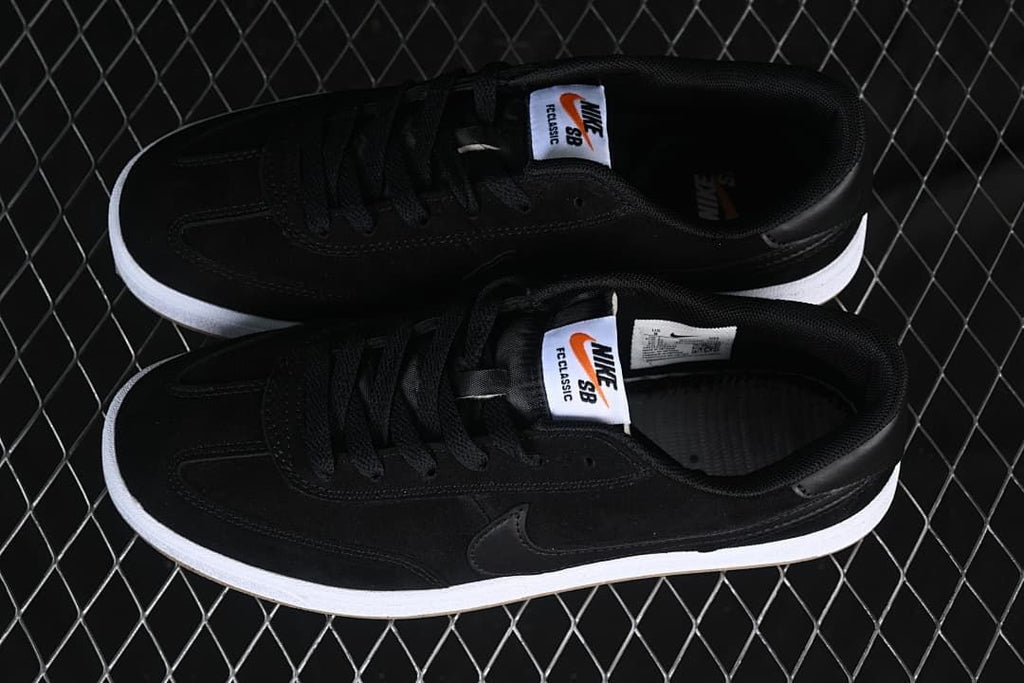 Pair of black Nike SB FC Classic shoes shown from above.