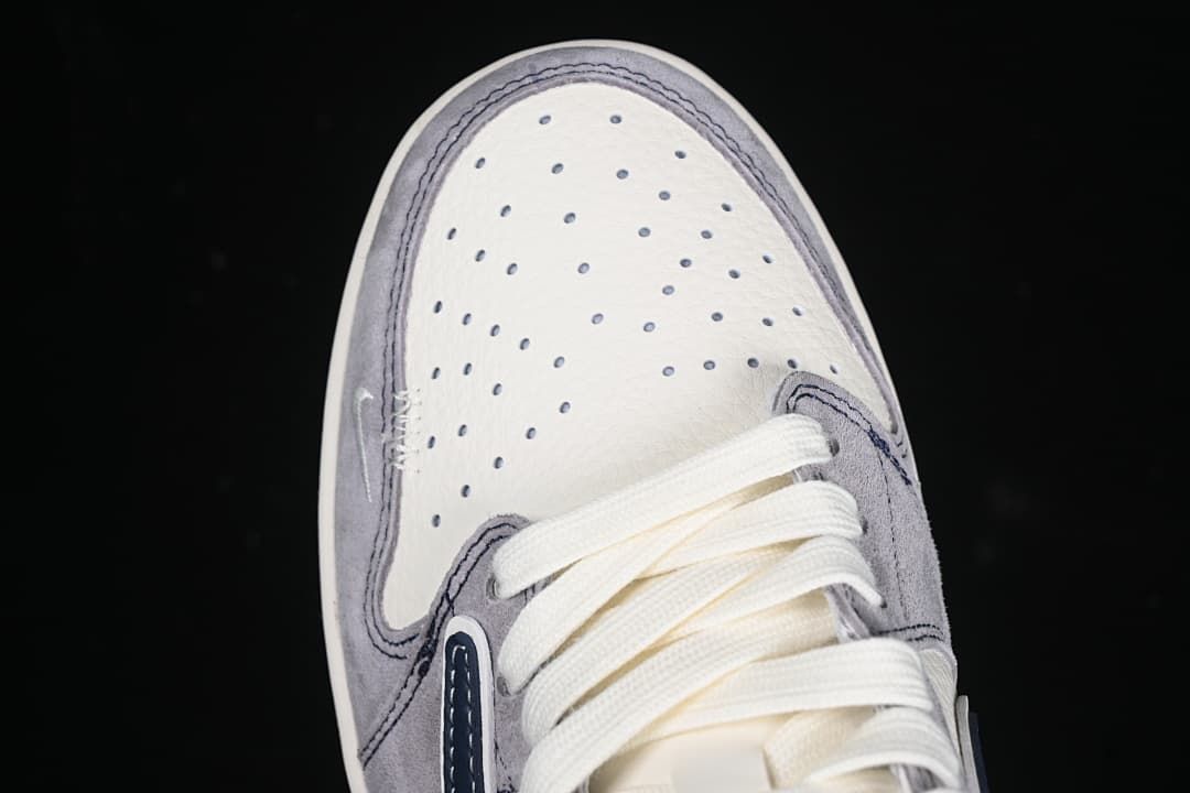 Top view of perforated off-white toe and grey overlays