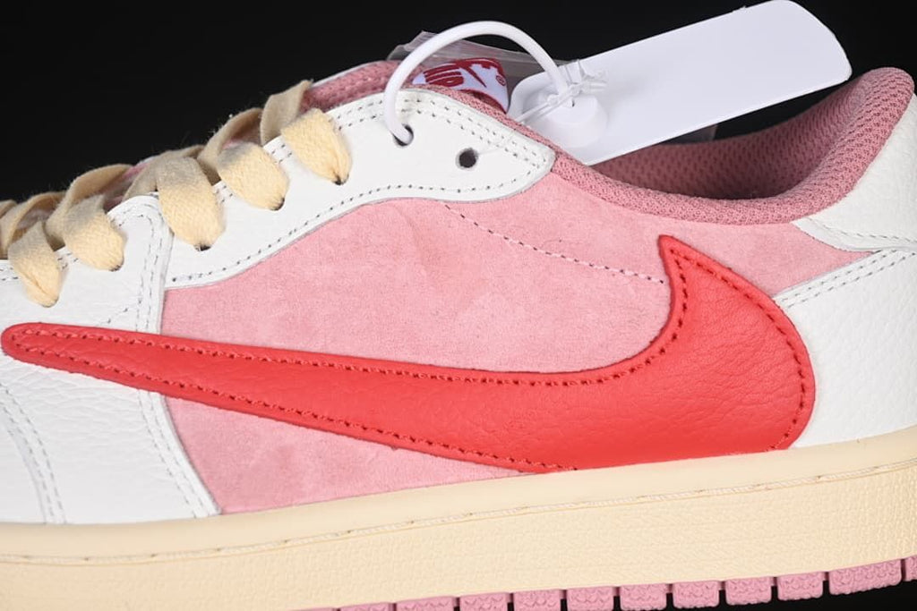 Close-up of pink side panel, red Swoosh, and cream midsole