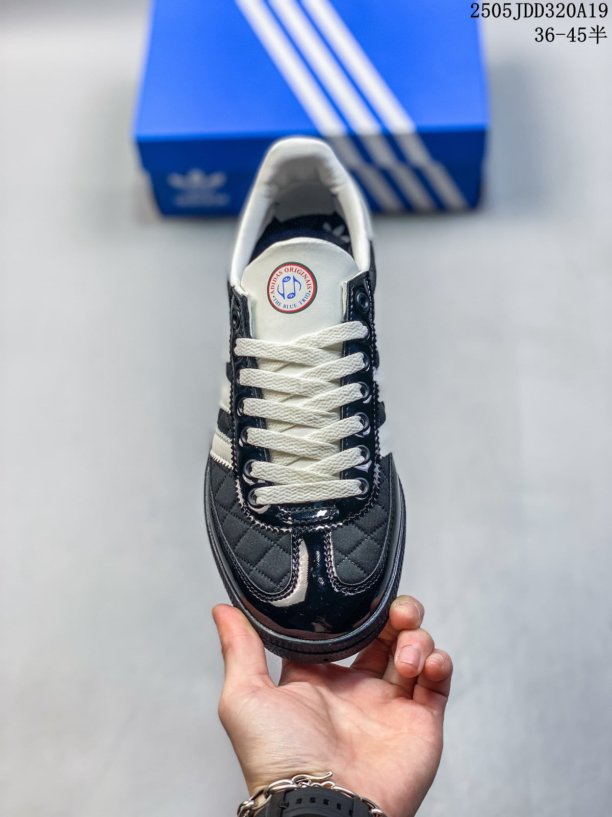Top view of the sneaker showing cream laces and quilted toe panels.