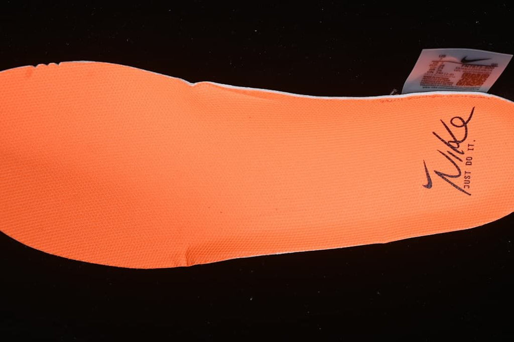 Orange insole with Nike branding.