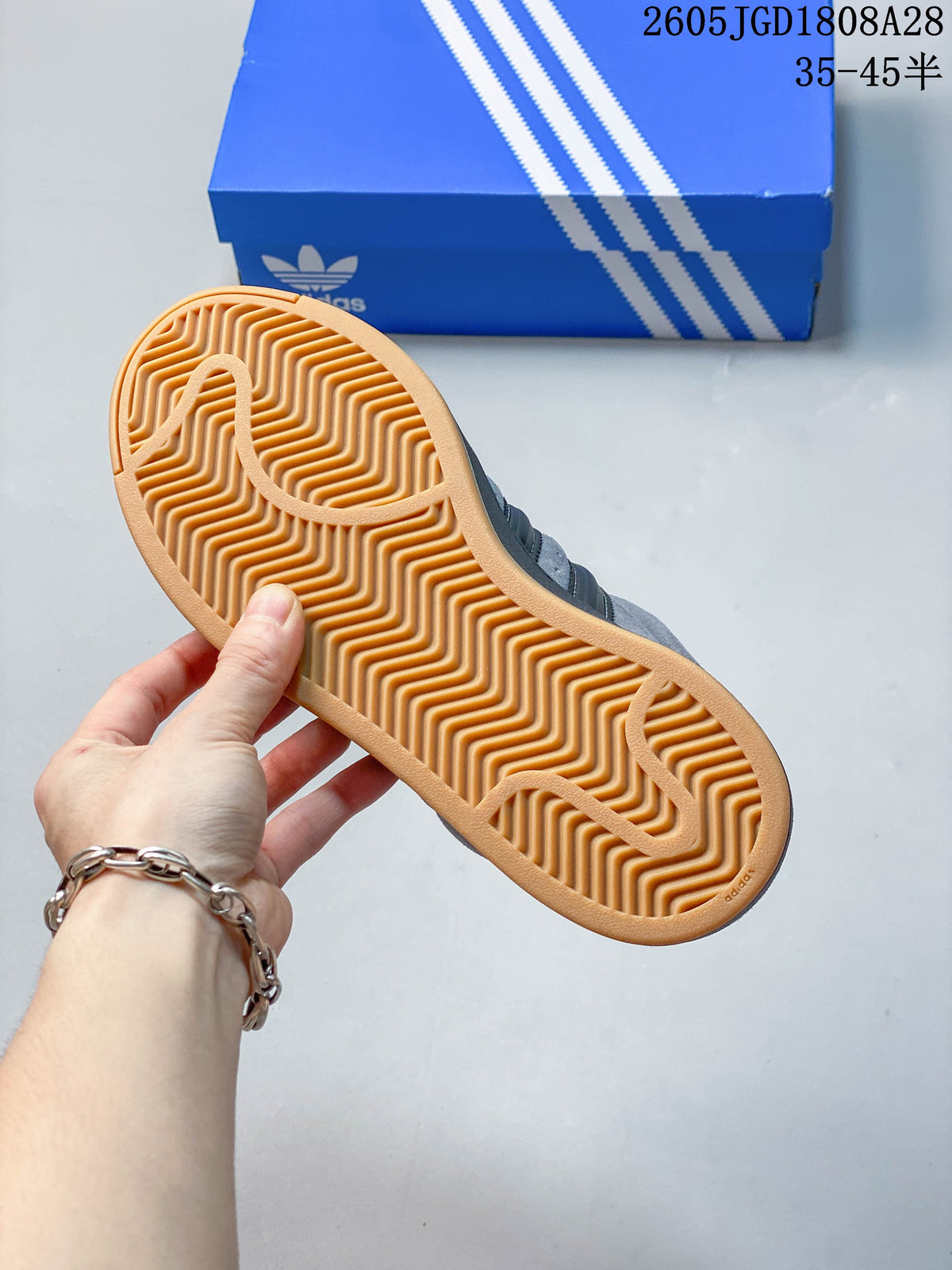 Close-up of the gum-colored outsole with a wavy tread pattern.
