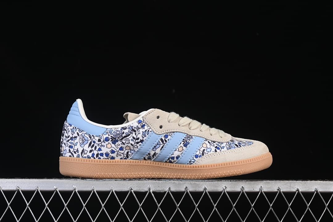Side profile of the sneaker showing the floral print, blue stripes, and gum sole