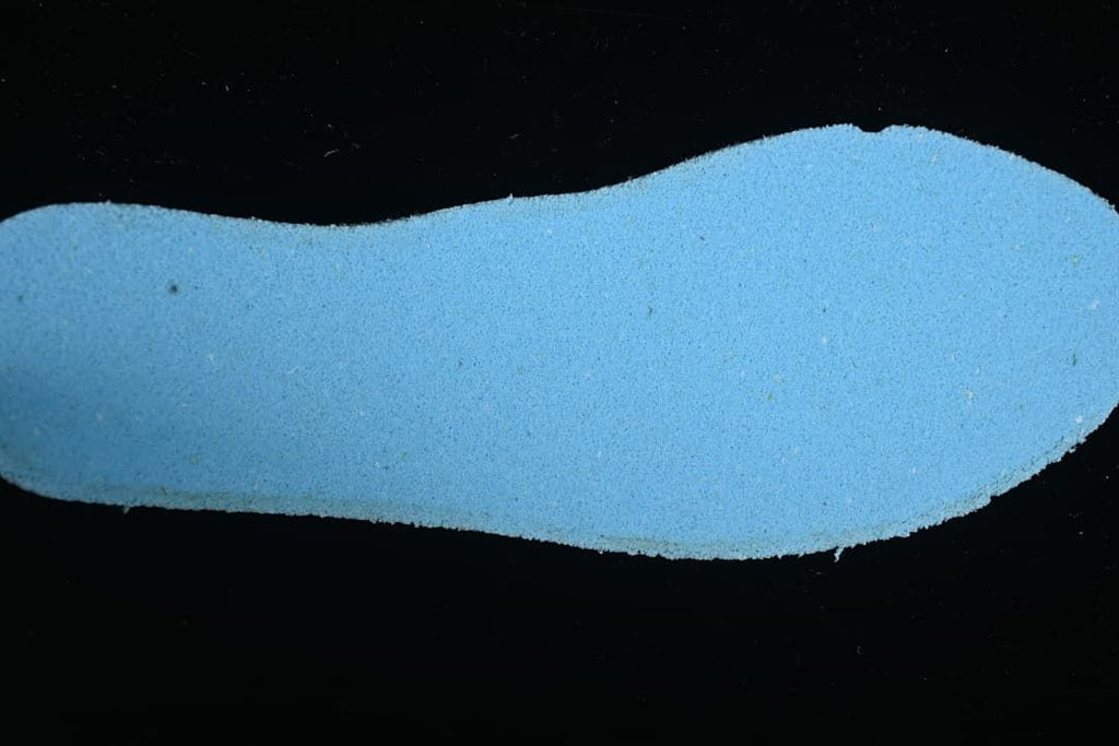 Close-up of the blue-toned underside of a shoe insert