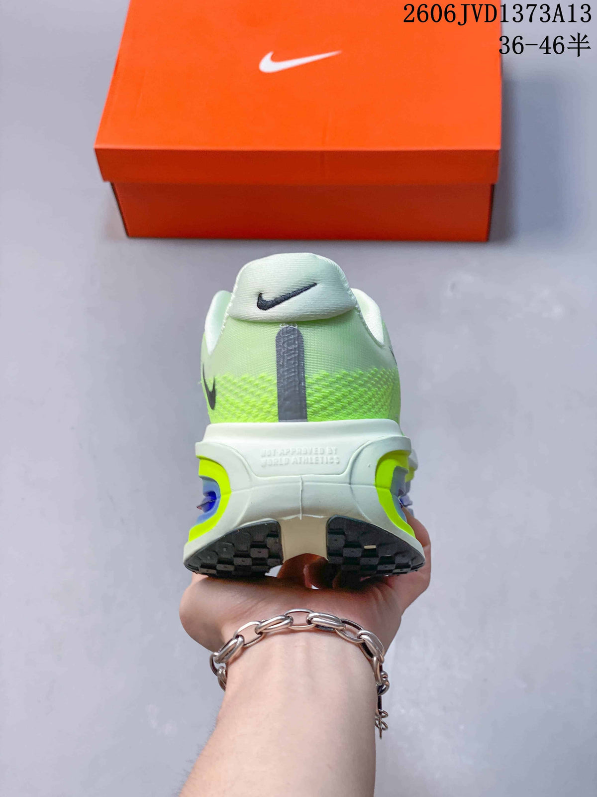 Rear view of the fluorescent green Nike Vomero Premium shoe