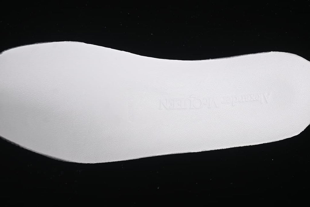 Close view of the white insole with faint Alexander McQueen branding.
