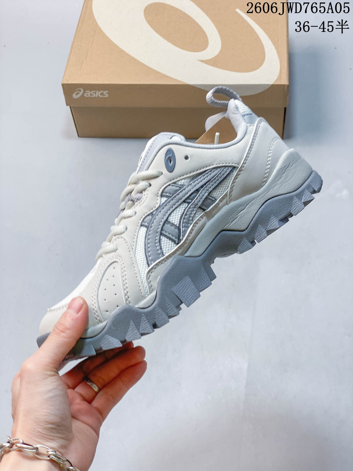 Side profile showing the layered detailing and chunky outsole of an ASICS Gel-TRUCK sneaker