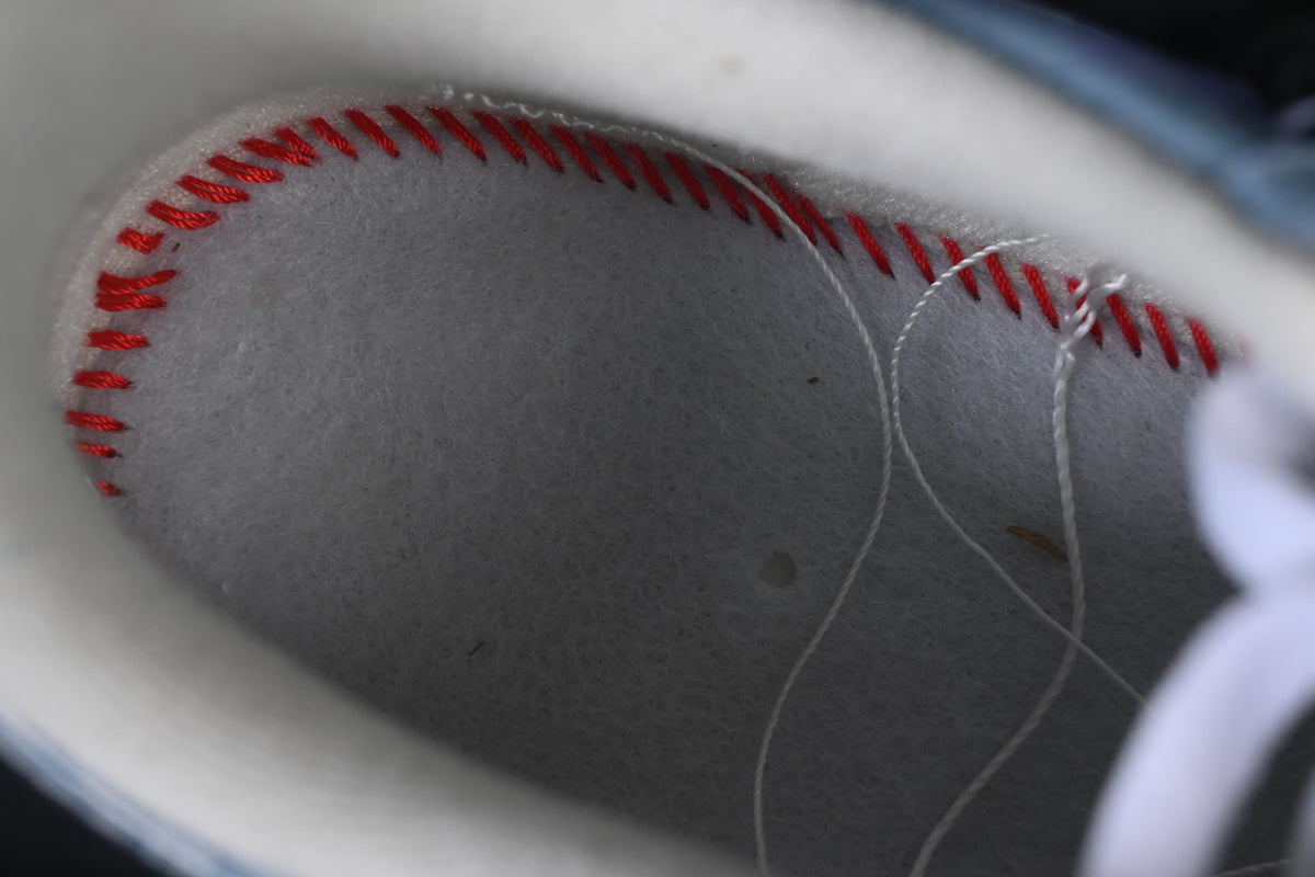 Close-up of the interior with red stitching along the insole edge
