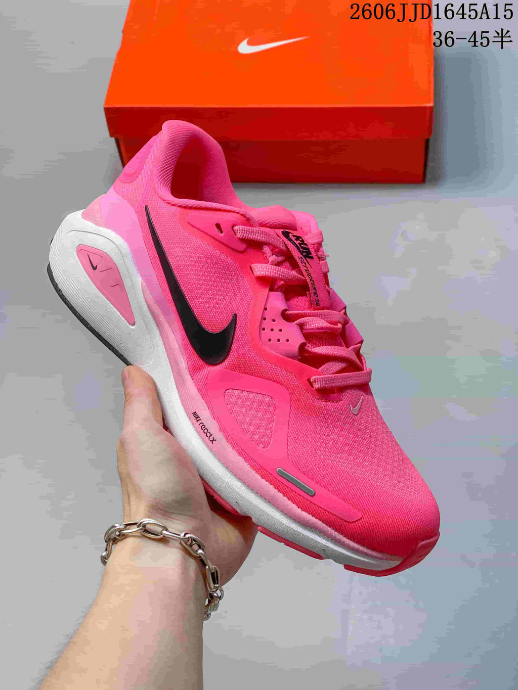 Bright pink Nike Air Structure 26 running shoe with a dark Swoosh.