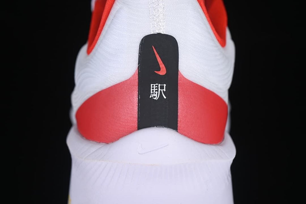 Rear view of the shoe with red heel panel and vertical heel detail