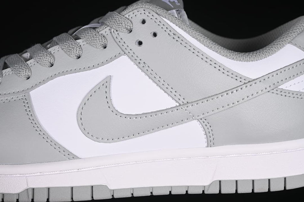 Close-up of the grey side Swoosh and layered panels