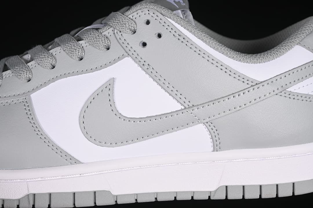 Close-up of the grey side Swoosh and layered panels