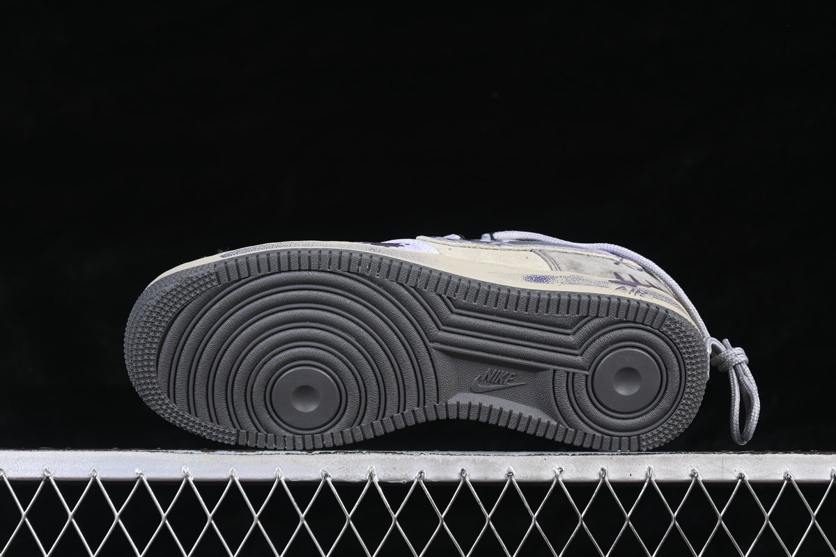 Underside of the sneaker showing the dark circular tread pattern