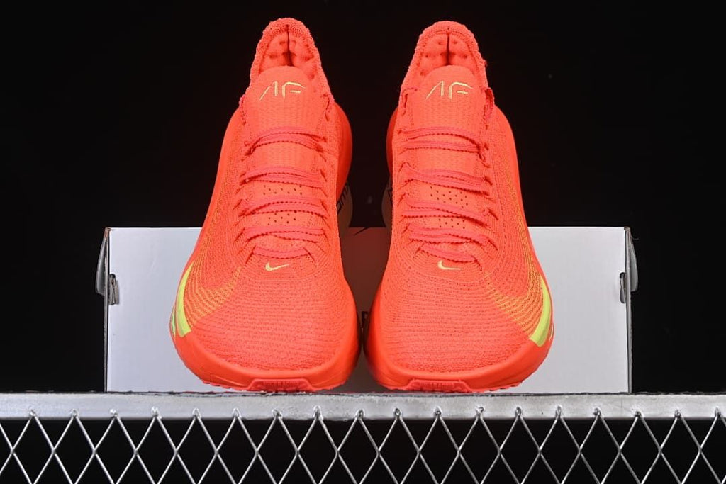 Front view of the pair showing the bright-crimson uppers and lime accents.