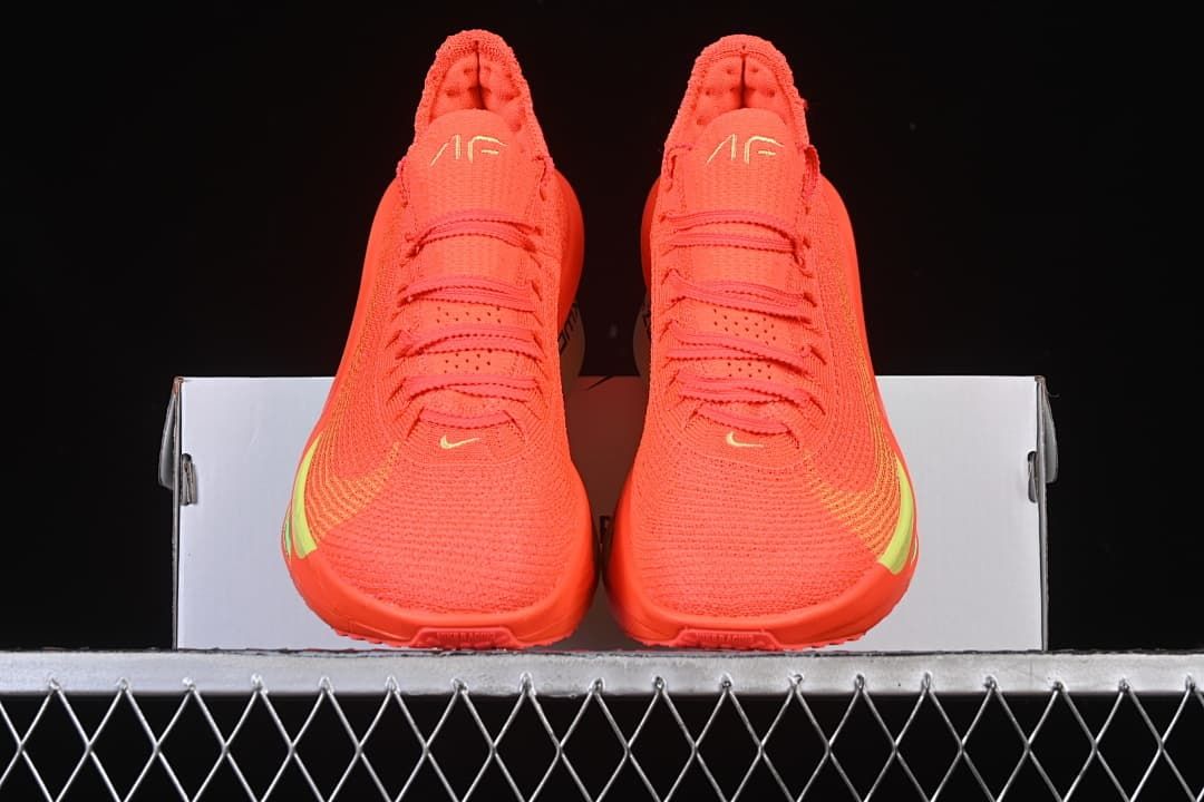 Front view of the pair showing the bright-crimson uppers and lime accents.