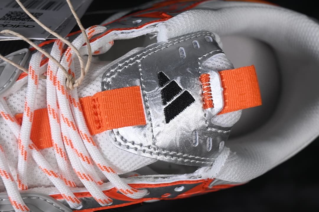 Top close-up of the tongue, pull tab, and laces