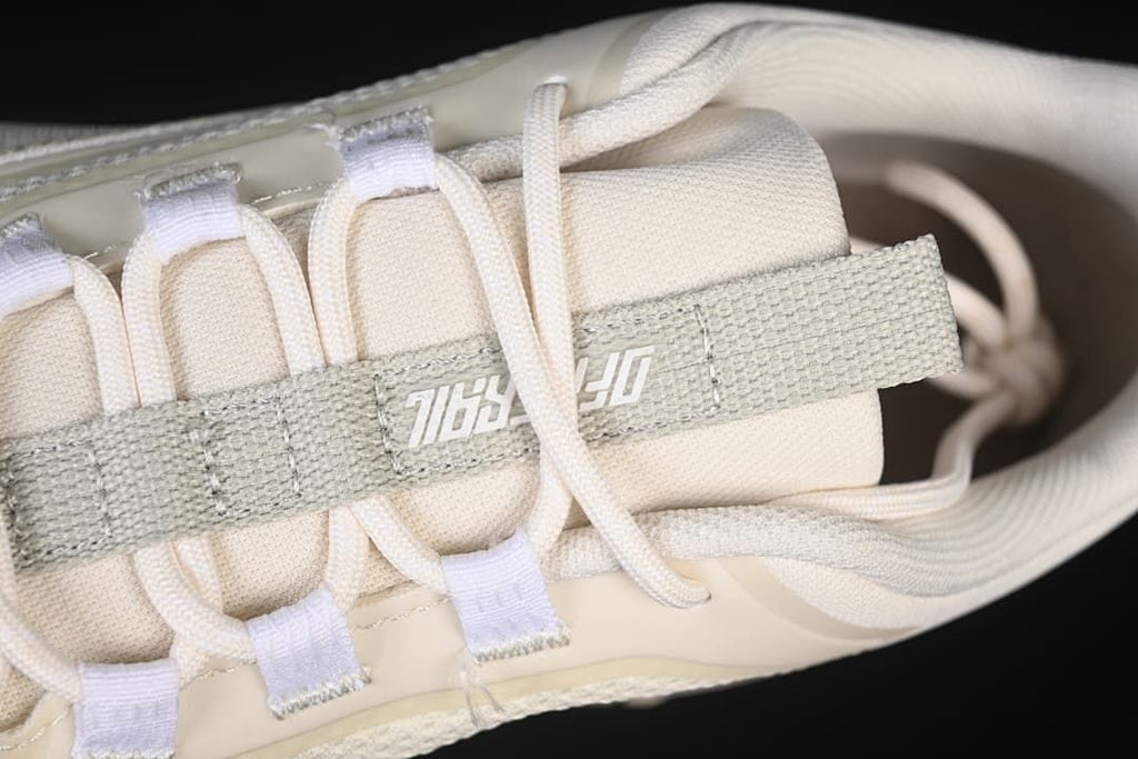 Top-down detail of the tongue strap and lace construction