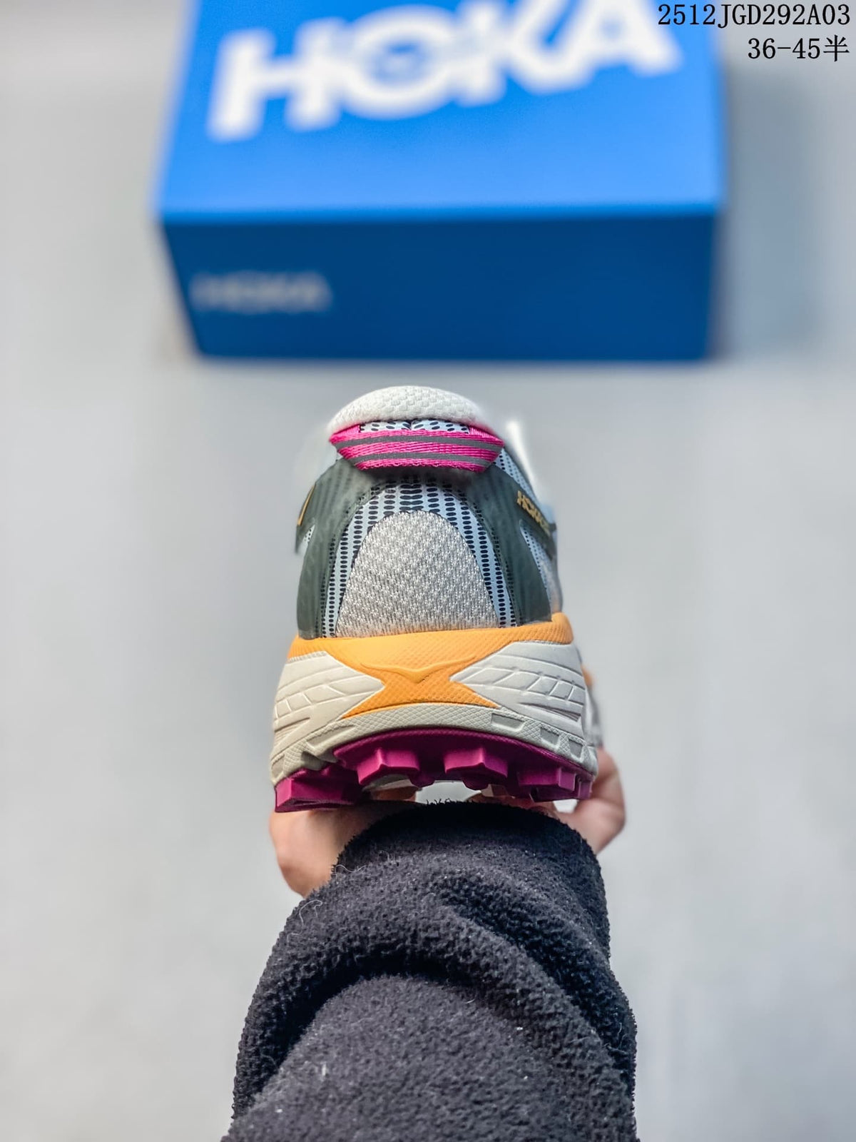 Rear view of a HOKA Mafate Speed 2 shoe with cream midsole and pink outsole accents.