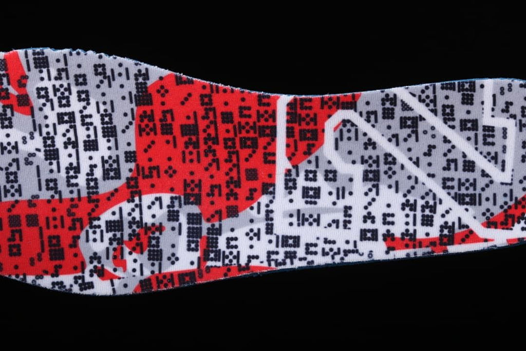 Close-up of a red, white, and black patterned shoe insert