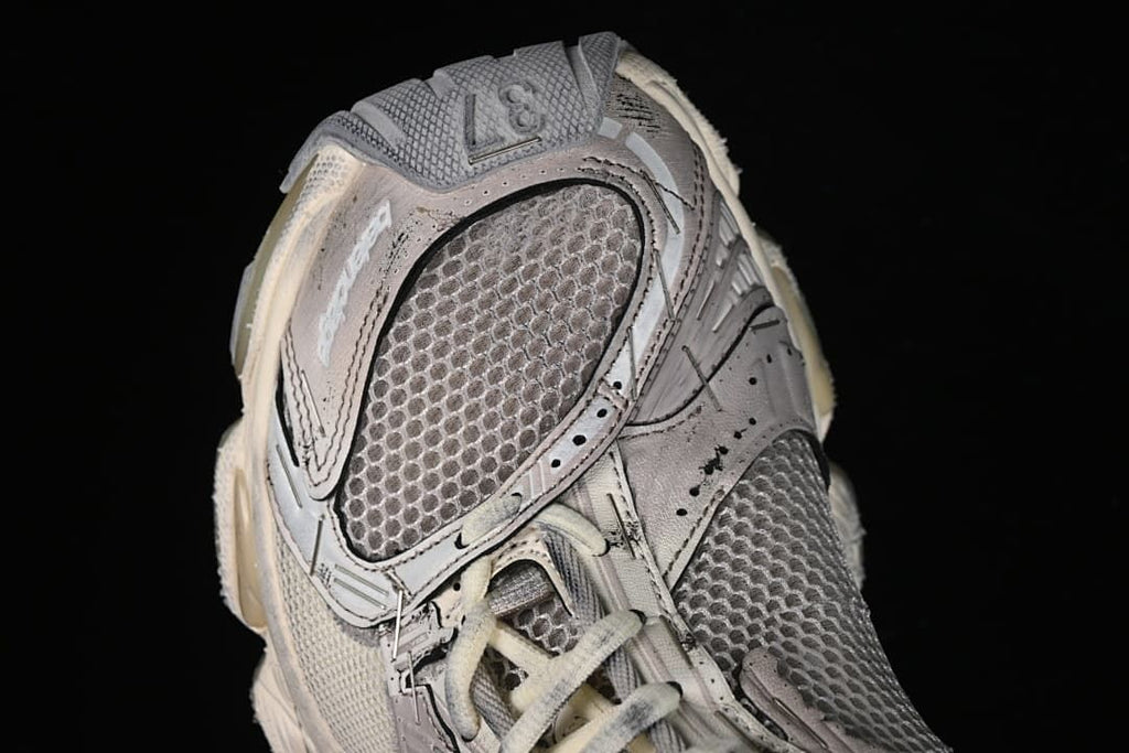 Angled close-up of the sneaker toe and mesh panels