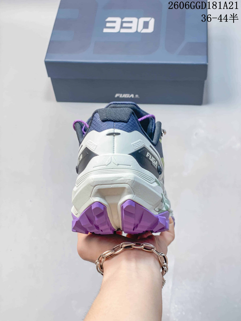 Rear view showing the heel and purple outsole lugs; image text shows 36–44.5.