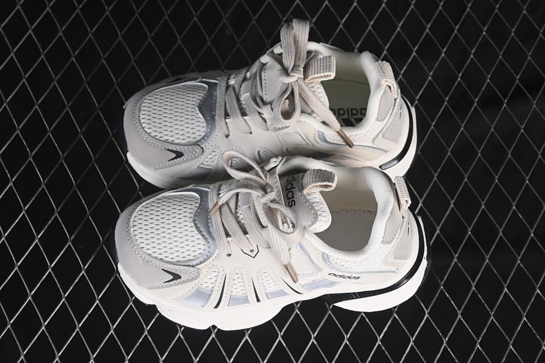 Pair of white and grey sneakers viewed from above