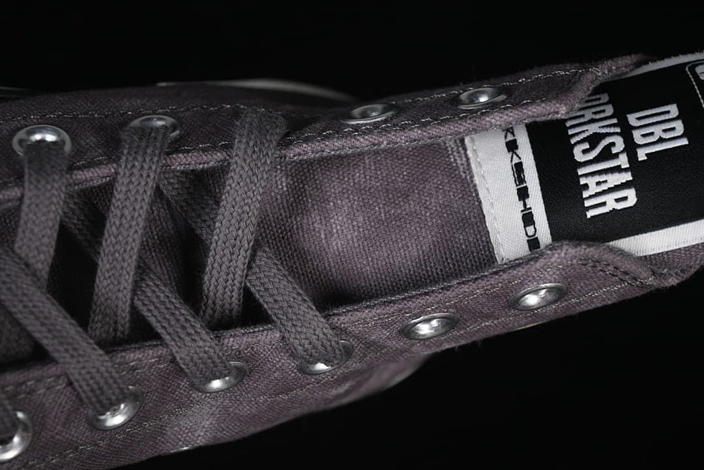 Close-up of the shoe's lace area and tongue branding.