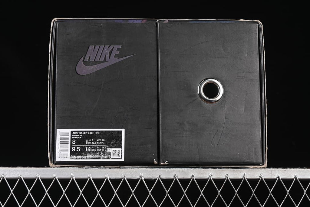Nike shoe box with Air Foamposite One label showing sample size information.