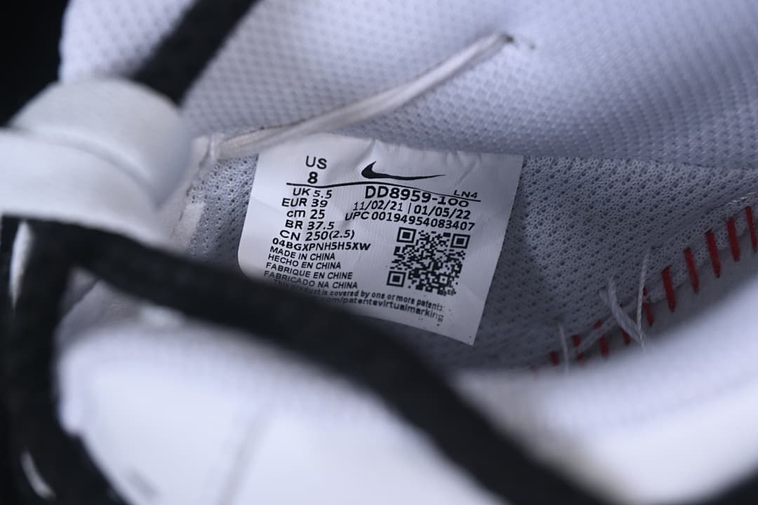 Close-up of the sneaker's size label, showing US 8 and EUR 39.