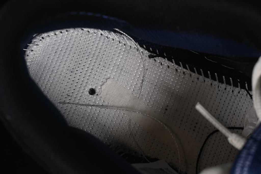 Close-up of the perforated inner lining and stitching