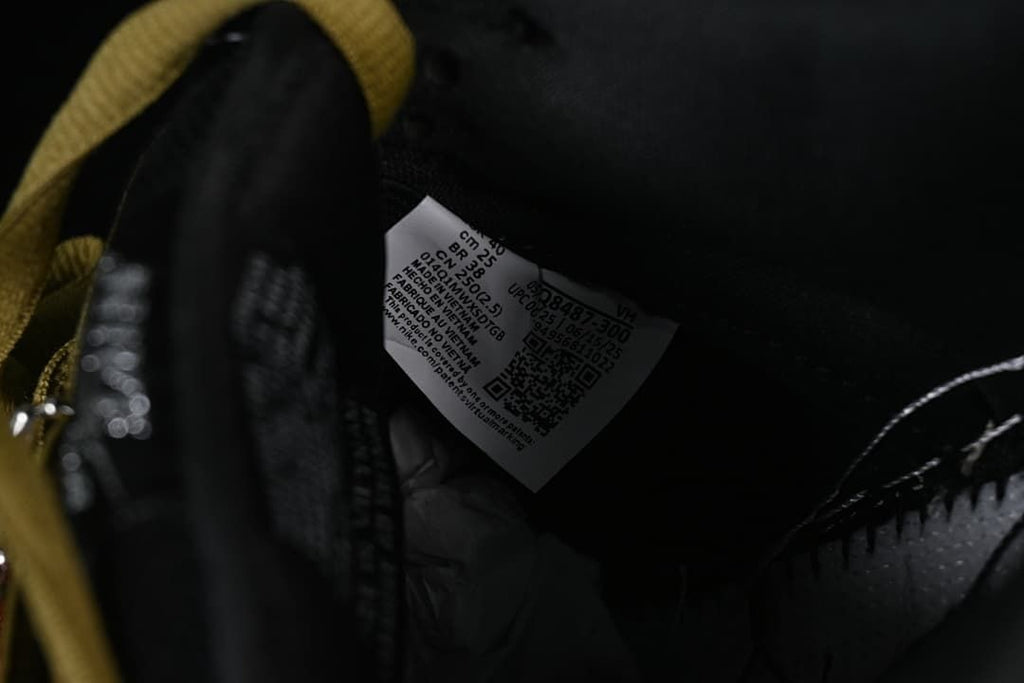 Interior shoe label and brown-gold lace detail