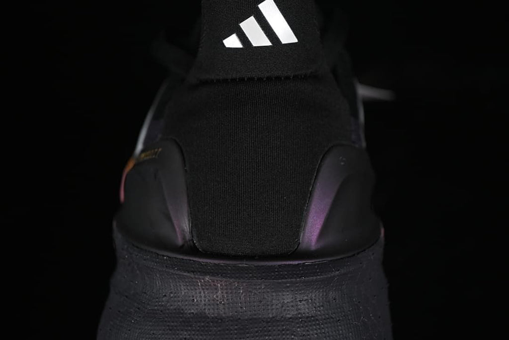 Rear view showing the heel, pull tab and Adidas logo.