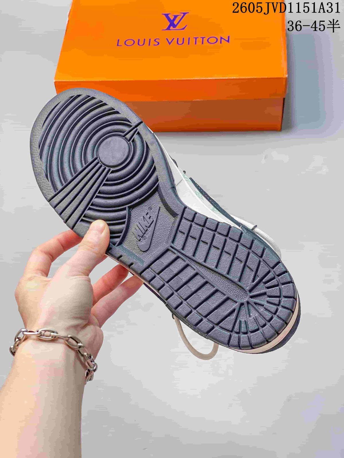 Close-up of the dark outsole and orange shoe box.