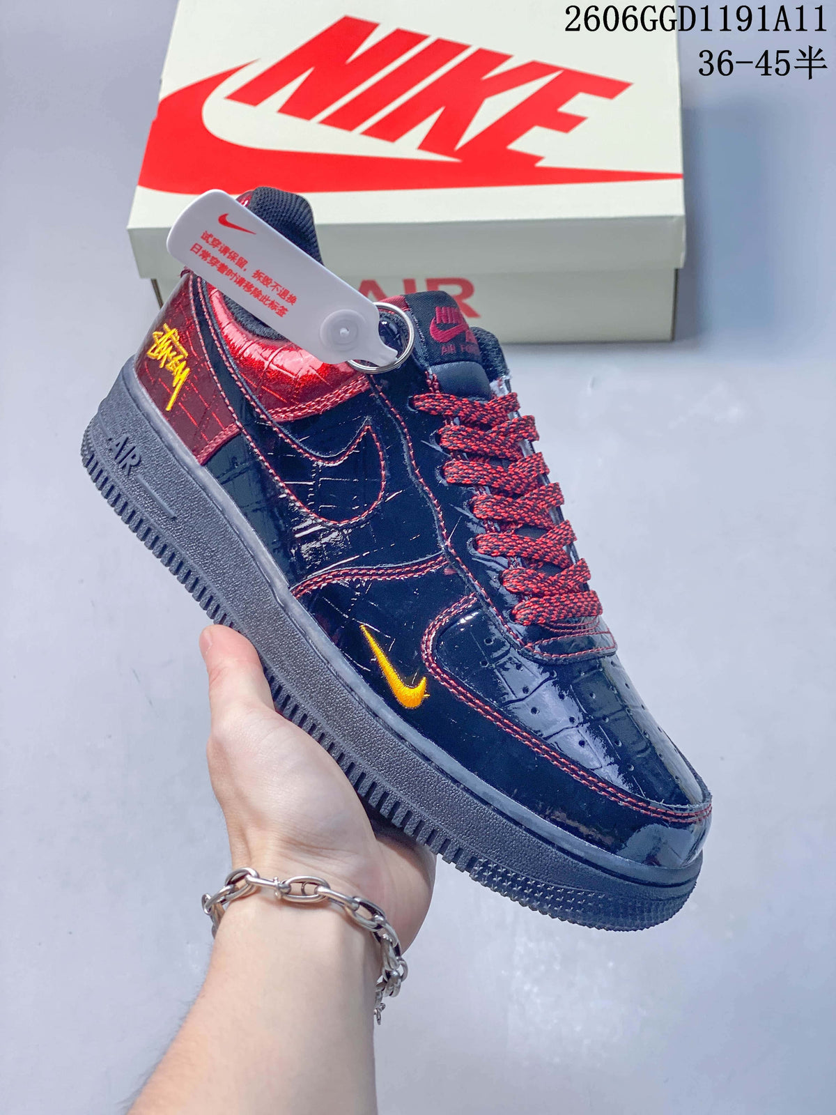 Angled side view highlighting the yellow side accent and burgundy heel