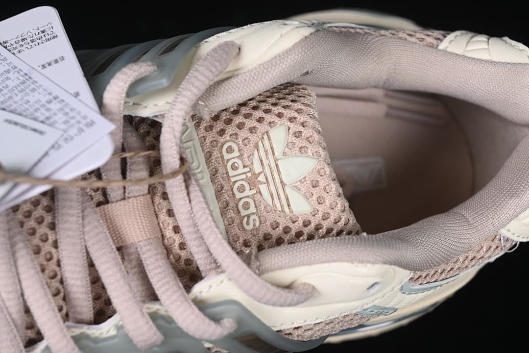 Top-down detail of the Adidas tongue logo, laces and padded collar